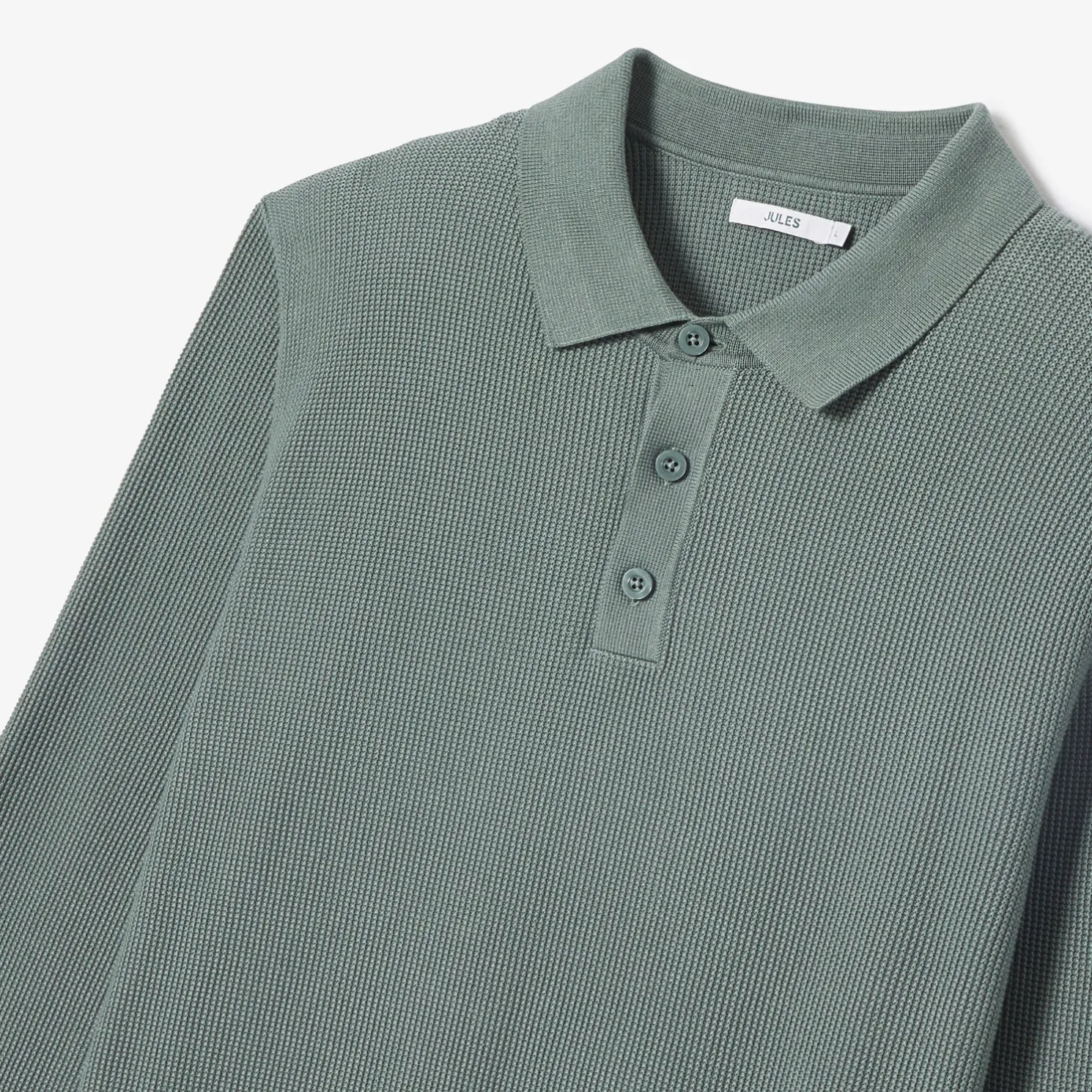 Polo met knopen in textuurstof